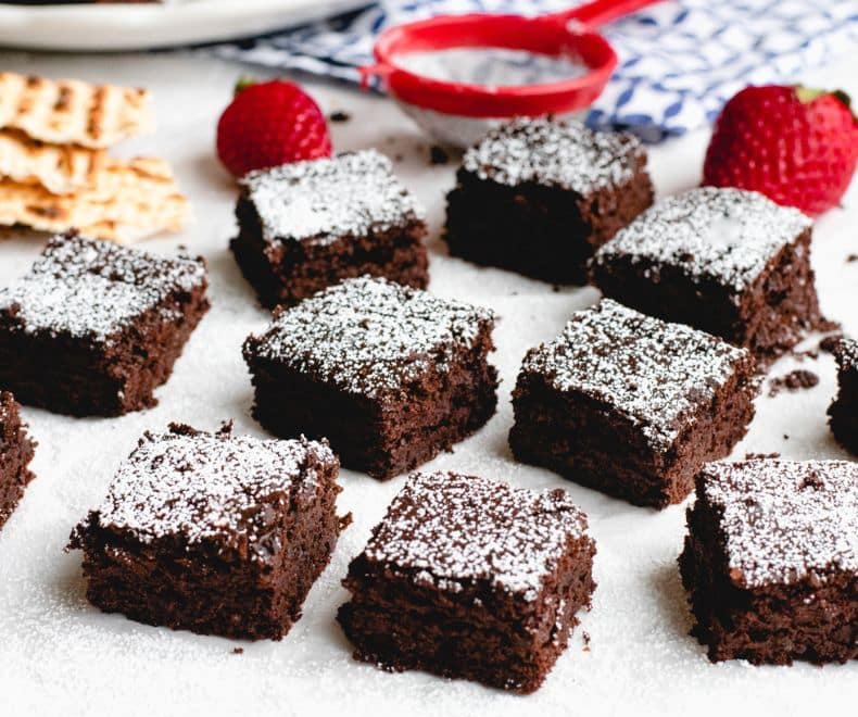 High-Fiber Black Bean Brownies squares with powdered sugar on top