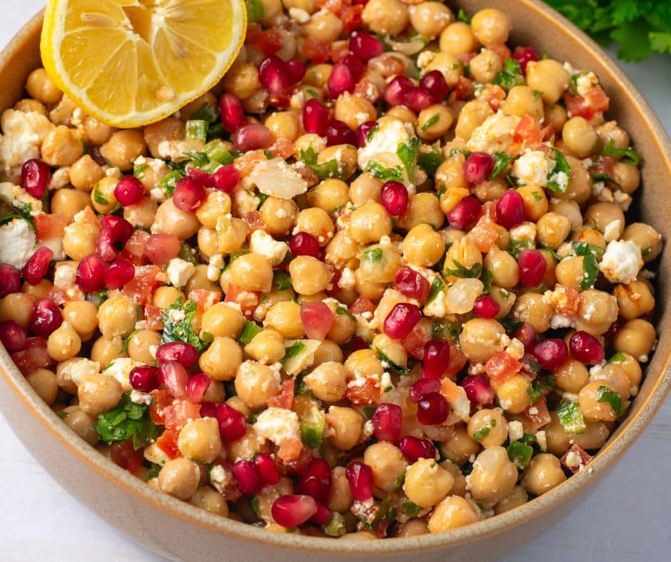 Chickpea Pomegranate Salad in a brown bowl
