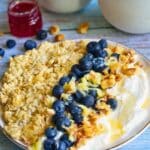 Princess Diana’s favorite breakfast – creamy overnight oats made with orange juice, topped with Greek yogurt, fresh blueberries, grated apple, and crunchy nuts.