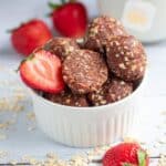 Chocolate strawberry energy balls on a white plate