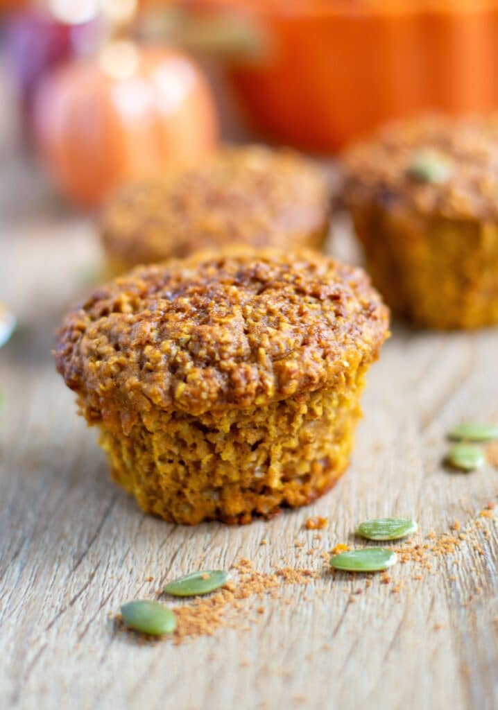 Healthy Pumpkin Protein Muffin with pumpkin seeds around